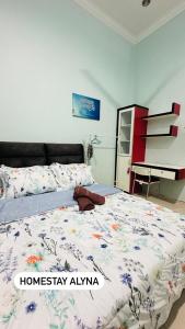Postel nebo postele na pokoji v ubytování Homestay AlyNa