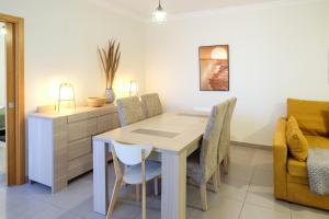 a dining room with a table and chairs at Casa Formosa - Tavira in Tavira