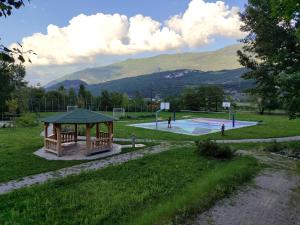 a basketball court with a gazebo in a park at Al Nido in Pietramurata