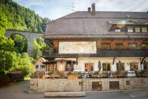 an old building with a large mural on the side of it at Hotel Hofgut Sternen in Breitnau