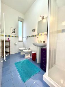 a bathroom with two toilets and a sink and a shower at B&B Luci a'mmare in Roseto degli Abruzzi +61 photos