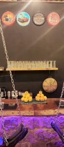a swing with lemons and plates of food on display at mountain view house in Kerak