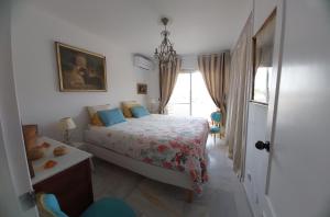 a bedroom with a bed and a window at casa caravane in Benalmádena +11 photos