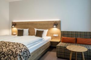 Tempat tidur dalam kamar di Hotel Hofgut Sternen