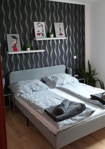Posteľ alebo postele v izbe v ubytovaní Barackos Apartman