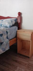 Tempat tidur dalam kamar di Hospedaje Puntos Cardinales