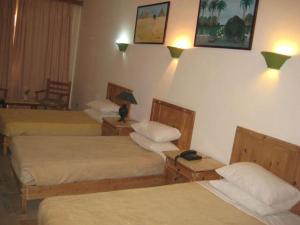 A bed or beds in a room at Morgenland Holly Village