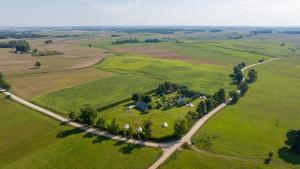 an aerial view of a farm in a field at Casa de campo glamping in Eželiškės