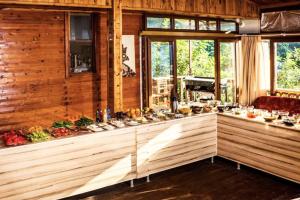 a room with a counter with alot of dishes at Fullmoon Camp in Faralya