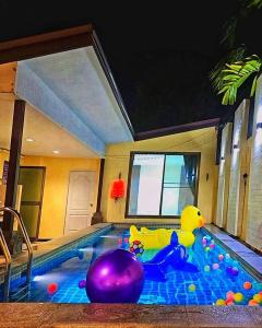 a pool with a rubber duck in the middle at F&K Pool Villa Pattaya in Jomtien Beach
