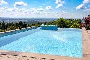 a swimming pool with a blue pool inflatables at House of Five Senses in Sveti Ivan Zelina