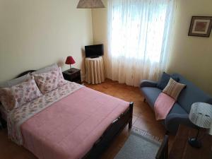 Cama ou camas em um quarto em Apartamentos em Casa da Avó Inês