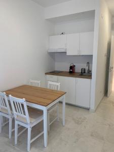 Kuchyň nebo kuchyňský kout v ubytování Suite 55 in centro