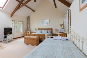 Ένα ή περισσότερα κρεβάτια σε δωμάτιο στο Kingfisher Cottage