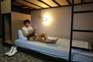 Postel nebo postele na pokoji v ubytování Asha Hostel