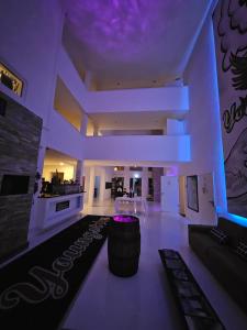 a large room with a bar and a kitchen at Designhotel Youngstar in Mannheim