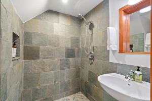 a bathroom with a sink and a shower at Redwood Oasis - Eco-luxury cabin with hot tub in the Santa Cruz Mountains in Ben Lomond +23 photos