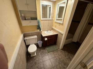 an overhead view of a bathroom with a toilet and sink at The Riverside Inn in Saint Anthony