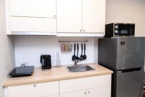 Kuchyň nebo kuchyňský kout v ubytování G14 SuperKingSizeBed 1этаж тихая сторона