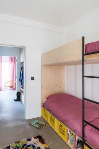 En eller flere senge i et værelse på Zacht Zilt