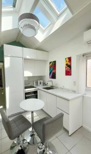 Køkken eller tekøkken på Maisonnette plain-pied avec son extérieur + 3 billeder