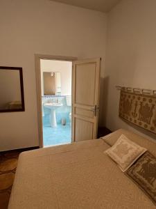 Postel nebo postele na pokoji v ubytování B&B Via dei mille