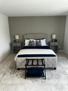 a bedroom with a large bed with two night stands at Modern Urban Oasis Gem Near Everything in Minneapolis