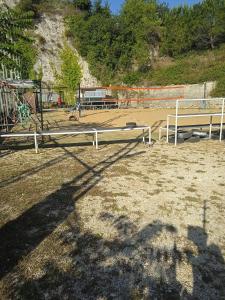 a park with two benches and a playground at AREA MULTISPORT Camping & Camper in Canicattini Bagni