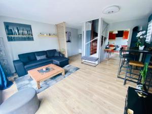 Χώρος καθιστικού στο Charmant Duplex en centre-ville