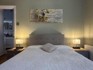 Katil atau katil-katil dalam bilik di My Sky London House Near Attractions