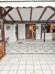a room with a tiled floor and a ceiling at Maison de 2 chambres avec jardin clos et wifi a Ducos in Ducos