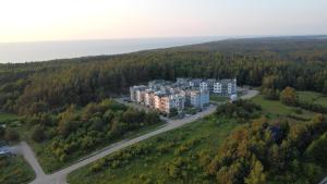 an aerial view of a large building on a hill at Apartamenty Przy Wydmie Dębina in Debina