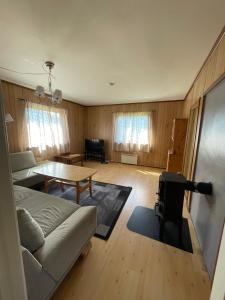 a living room with a couch and a table at Kvam - Stegastein in Aurland