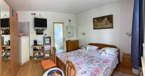 Postel nebo postele na pokoji v ubytování Apartment and room Josip 2007