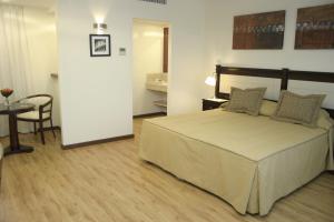 Cama ou camas em um quarto em Villaggio Hotel Boutique