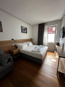 Postel nebo postele na pokoji v ubytování GRANDI 32 Boutique Residence