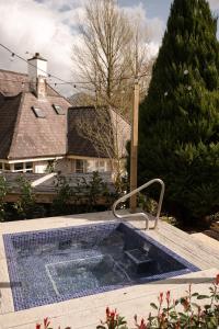 a hot tub in a yard with a house at Galgorm in Ballymena