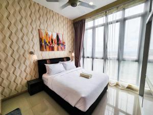 En eller flere senge i et værelse på D Pristine - Cozy Family Retreat by Cowidea