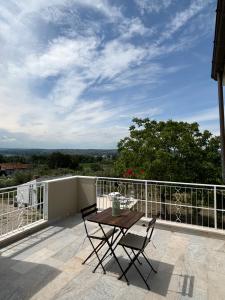a patio with a table and chairs on a balcony at Donna Francesca Guest House - Costa dei Trabocchi in Torino di Sangro