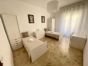 Letto o letti in una camera di Home Sisters