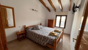 a bedroom with a bed with two towels on it at CA LIDIA - Apartamentos Turisticos EL BALCONET in Benimantell +66 photos