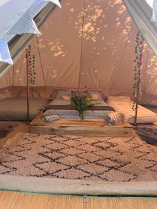 a room with a bed in a tent at Bluebell Tent at Ballyward Croft in Ardkeen