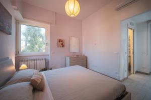 Postel nebo postele na pokoji v ubytování Villa Silvia Fregene