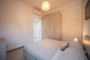 Postel nebo postele na pokoji v ubytování Villa Silvia Fregene