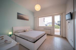 Postel nebo postele na pokoji v ubytování Villa Silvia Fregene