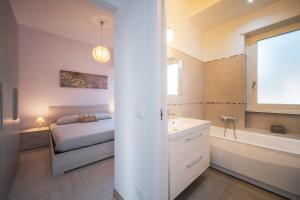 Postel nebo postele na pokoji v ubytování Villa Silvia Fregene