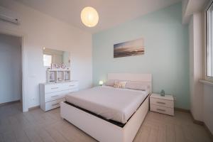 Postel nebo postele na pokoji v ubytování Villa Silvia Fregene