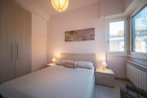 Postel nebo postele na pokoji v ubytování Villa Silvia Fregene