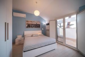 Postel nebo postele na pokoji v ubytování Villa Silvia Fregene