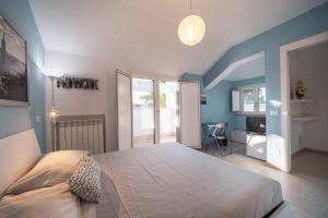 Postel nebo postele na pokoji v ubytování Villa Silvia Fregene